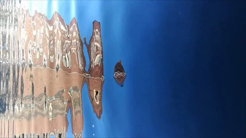 Lockdown shot of building reflecting in the water Video stock 114880372