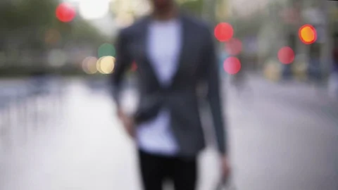 Lockdown shot of businessman using smart phone while walking on city street Stock Footage