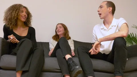 Lockdown shot of three business executives talking while sitting on sofa Video stock 114872654