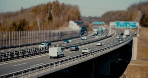Lockdown shot of traffic moving on highway during sunny day, Mauren, Stock Footage 75255112