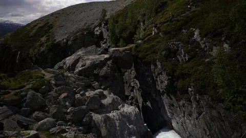 Lockdown shot of two hikers hiking down the hill Stock Footage 114882818