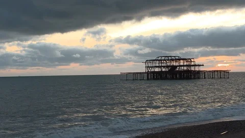 Lockdown shot of West Pier over sea against cloudy sky at dusk Video stock 120434307