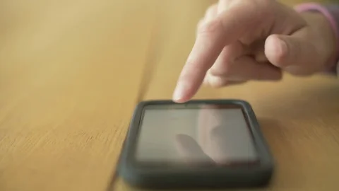 Lockdown Shot Of Woman Scrolling Screen On Smartphone At Table Stock Footage 79657190