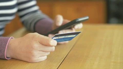 Lockdown Shot Of Woman Using Credit Card And Smartphone Stock Footage 79657243