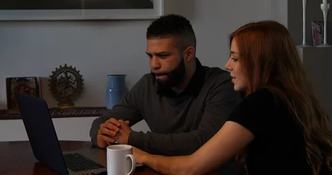 Lockdown shot of young couple discussing over laptop Stock Footage 119773048