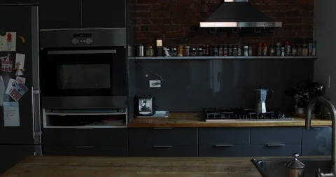 Lockdown shot of young couple preparing meal together in kitchen Stock Footage 120087167