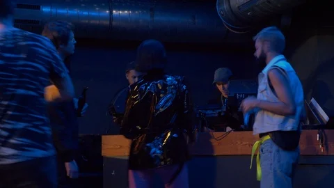 Lockdown shot of young people dancing and talking in party at night club Stock-Footage 114874906