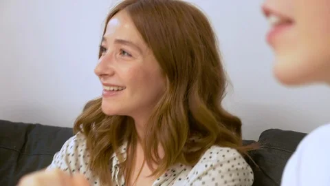 Lockdown shot of young people talking to each other while sitting on sofa 스톡 동영상 114872703