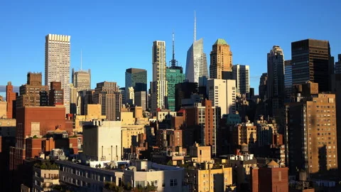 Lockdown Slow Motion Shot Of Buildings And Skyscrapers Against Blue Sky In City Vídeos de archivo 237140710