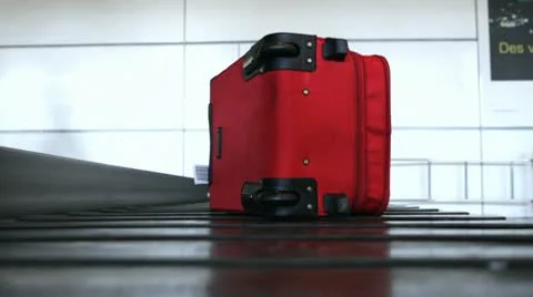 Lockdown, Surface level, Suitcase on baggage carousel at airport Video stock 10701276