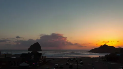 Lockdown Time Lapse Shot Of Illuminated Hotel On Beach During Sunset - British Stock Footage 160314483