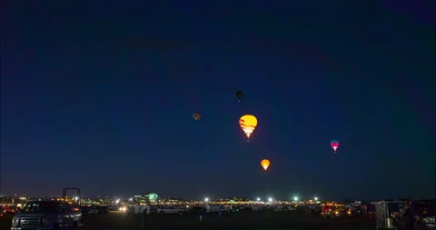 Lockdown Time Lapse Shot Of Illuminated Hot Air Balloons Flying In Traditional Stock Footage 160329023