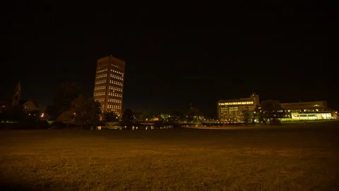 Lockdown Time Lapse Shot Of Illuminated Buildings In College Campus From Dusk To Stock Footage 219438576