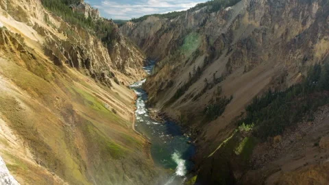 Lockdown Time Lapse Shot Of River Flowing Amidst Rock Formations At Yellowstone Stock Footage 160315066