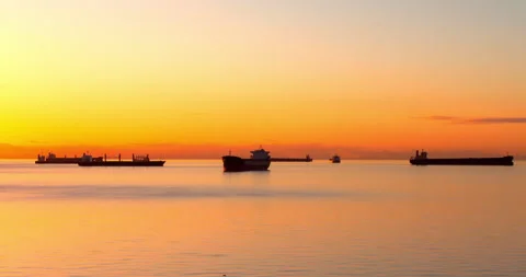 Lockdown Time Lapse Shot Of Ships Moored In Sea Against Cloudy Sky During Sunset Stock Footage 160320496