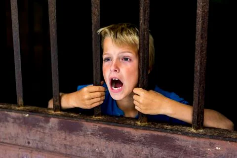 Locked up boy, screaming for help Photos