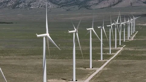 Locked Off Camera Wind Turbines in Oper Desert Drone Aerial View Stock Footage 221112691