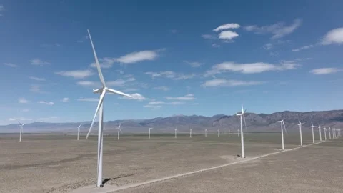 Locked Off Camera Wind Turbines in Oper Desert Drone Aerial View 動画素材 335421614