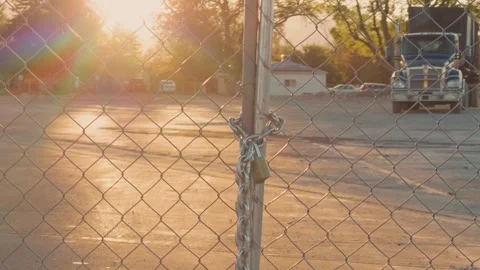 Locked Chain Link Fence at Sunset Video stock 346120393