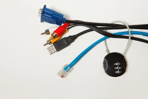 Locked cipher padlock and various cables on white background. Stock Photos