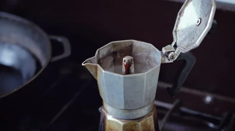 Locked down close up - Coffee brewing in stove top Italian moka pot Stock Footage 63392362