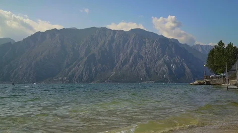 Locked down real time shot of a mountain on lake Garda. Lake Garda is the Stock Footage 122288686