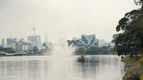 Locked down real time shot of KL park and modern downtown skyline of Kuala 스톡 동영상 126059567