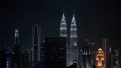 Locked down shot of modern skyline in Kuala Lumpur at night time. Real time 스톡 동영상 125536710