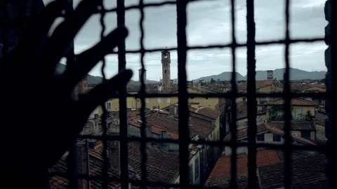 Locked Inside Medieval Italian City Due to Coronavirus, Hand Behind Fence Stock Footage