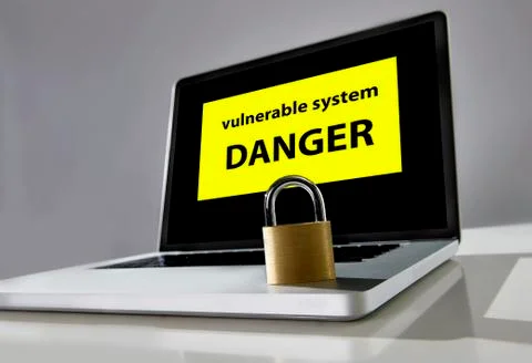 Locked lock on keyboard of computer laptop with warning message on screen Stock-Fotos