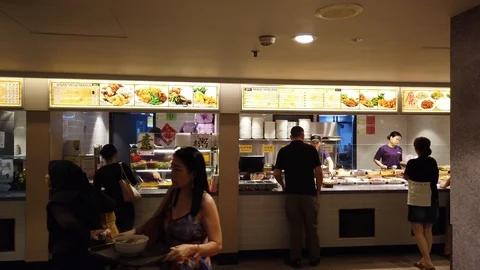 Locked medium wide shot of self serving and small fast food restaurant Stock Footage 109354968