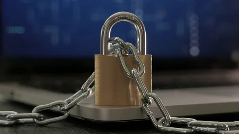Locked Padlock, Close-Up, standing on top of a laptop with a chain going around Video stock 75693543