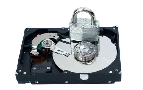 Locked padlock on hard disk Stock Photos