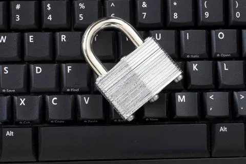 Locked padlock on keyboard Stock Photos