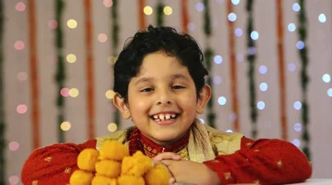 Locked-on shot of a boy smiling during Diwali festival Stock Footage 30046932