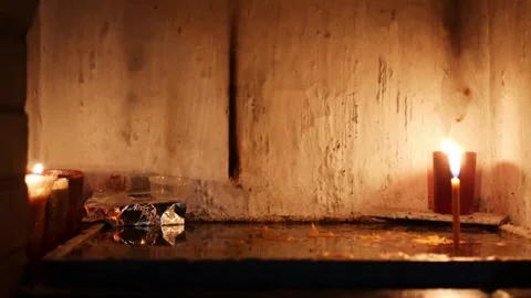 Locked shot of burning candles in a tiny hermitage Stock Footage 291871772