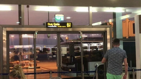 A Locked shot of the closed bus sliding gates at Phuket Airport. Stock Footage 109096642