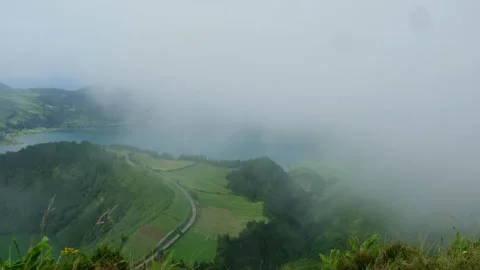 Locked-off viewpoint of Sete Cidades caldera as cloud drifts across the crater Stock Footage 344530333