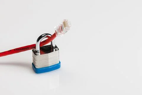 Locked In: Visualizing Cyber Security Through a Padlocked Ethernet Cable 스톡 사진