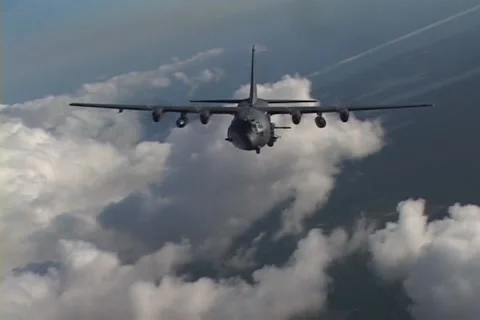 Lockheed AC-130 hercules gunship in flight firing its gun Stock Footage 51438285