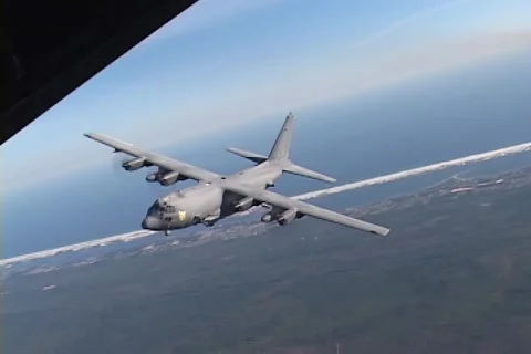 Lockheed AC-130 hercules gunship in flight firing its gun Video stock 51438297