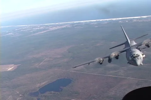 Lockheed AC-130 hercules gunship in flight firing its gun Stock Footage 51438299