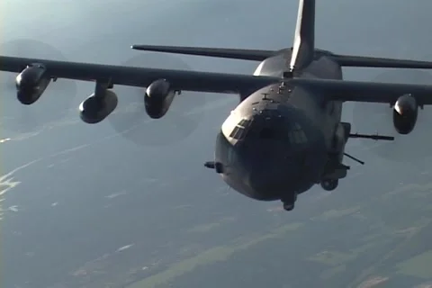 Lockheed AC-130 hercules gunship in flight firing its gun Video stock 51438300