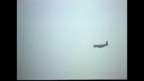 Lockheed C-130 Hercules aircraft flies in air - 1969 Stock Footage 91263722