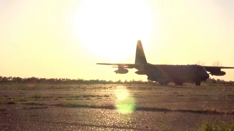 Lockheed C-130 Hercules aircraft taxiing after landing at airbase - 2015 Video stock 99976319