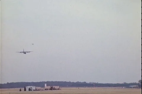 Lockheed C-130 Hercules aircraft lands on airfield - 1977 Stock Footage 106061428