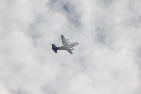 Lockheed C-130 Hercules Ascending Through Scottish Clouds Stock Photos