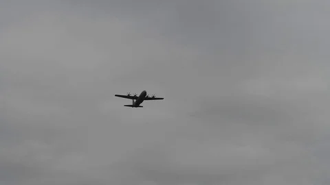 Lockheed C-130 Hercules drop cargo with parachute - 2017 Stock Footage 92304993