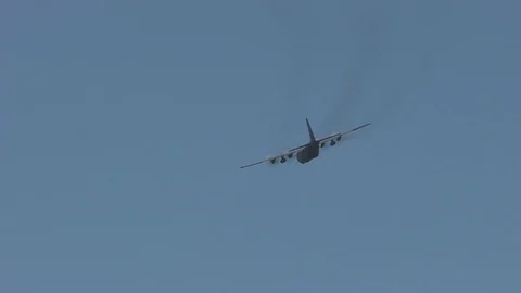 Lockheed C-130 Hercules flies in mid-air - 2016 Stock Footage 89215373
