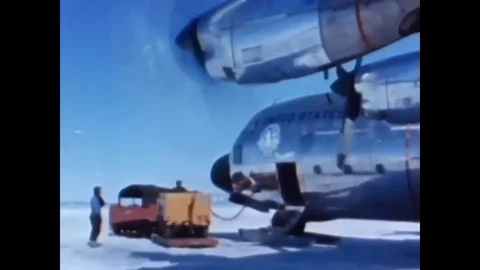 A Lockheed C-130 Hercules turboprop military transport aircraft taxis, flies, Stock Footage